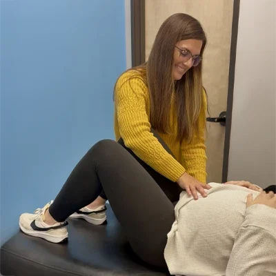 Rachel Franco Adjusting a Pregnant Woman